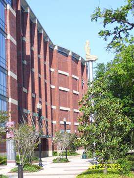 A tall red brick building

Description automatically generated