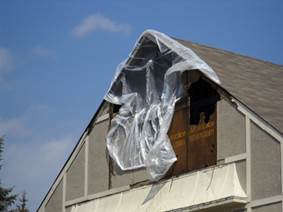 A sign on the side of a building

Description automatically generated