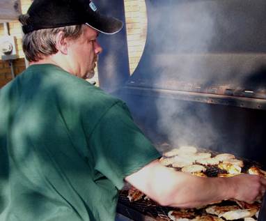 A person cooking pizza

Description automatically generated