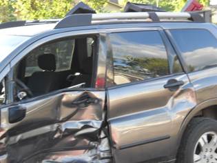 A car parked in a parking lot

Description automatically generated